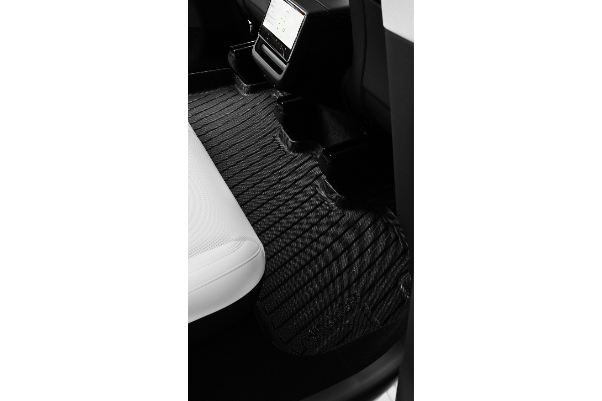 The JOWUA Model Y 2025+ Interior / Trunk Full Coverage Liner Combo offers black all-weather protection for rear passengers in vehicles with white seats and a center console—an essential Tesla Model Y accessory.