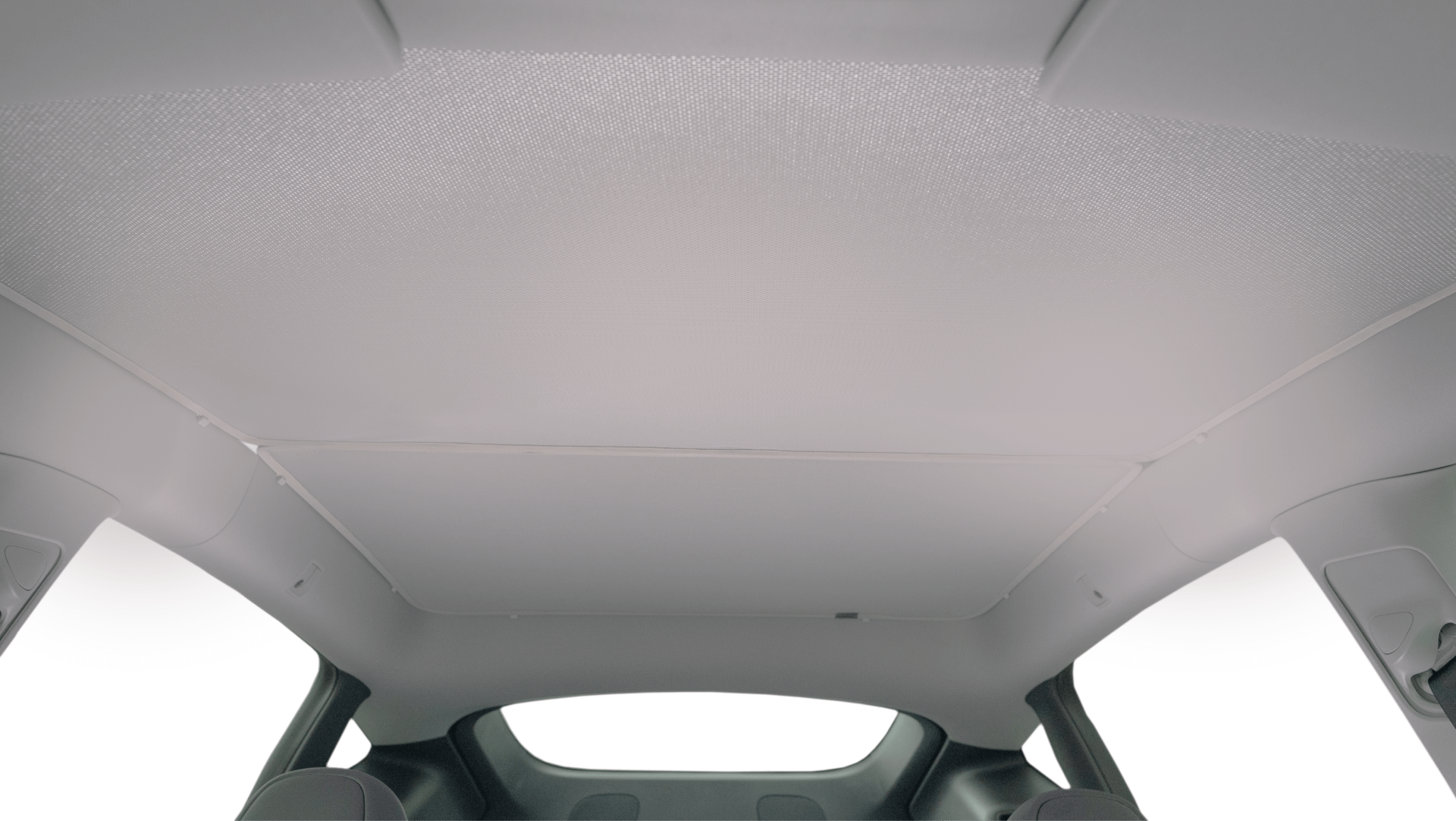 The car's interior roof features the JOWUA All Model Y Glass Roof Sunshade (Juniper 2025+ / 2021-2024), a light-colored mesh fabric sunroof offering style and UV protection. It spans most of the ceiling, framed by visible structural elements around the edges.